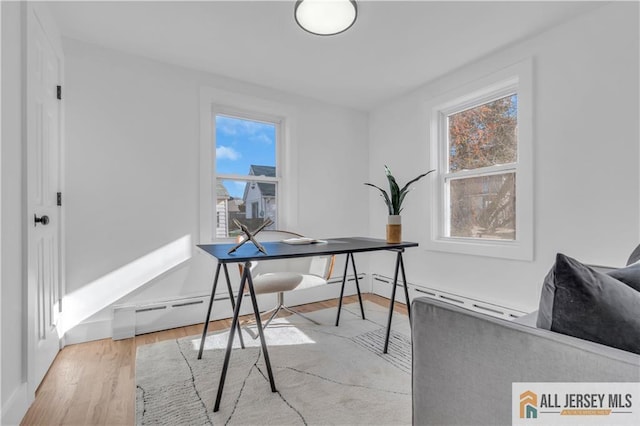 8 1st St, Sayreville, NJ 08872 - office featuring wood finished floors, plenty of natural light, baseboard heating, and baseboards