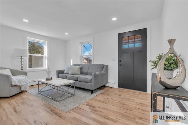 8 1st St, Sayreville, NJ 08872 - living room featuring light wood finished floors, recessed lighting, and baseboard heating