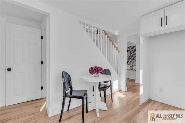 8 1st St, Sayreville, NJ 08872 - dining space featuring light wood-style flooring and stairway