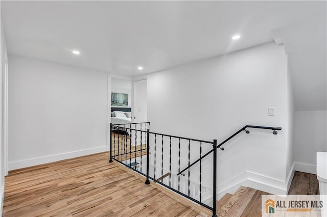8 1st St, Sayreville, NJ 08872 - staircase featuring wood finished floors, recessed lighting, and baseboards
