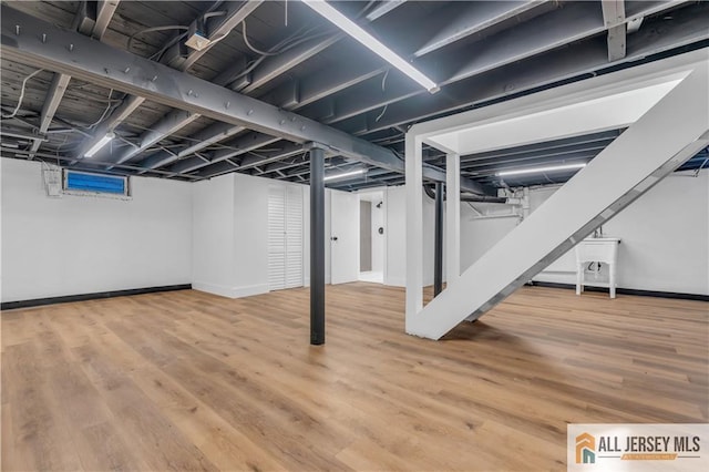 8 1st St, Sayreville, NJ 08872 - finished below grade area featuring wood finished floors and baseboards