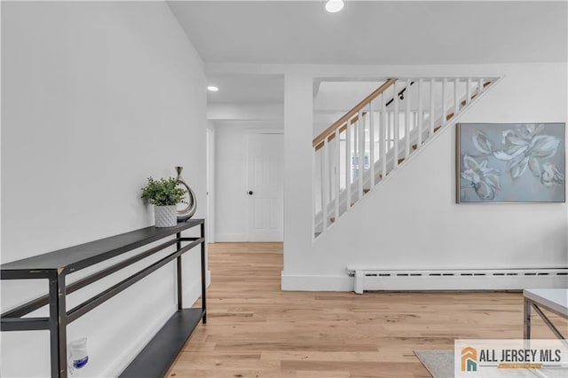 8 1st St, Sayreville, NJ 08872 - foyer featuring stairs, recessed lighting, a baseboard radiator, and wood finished floors
