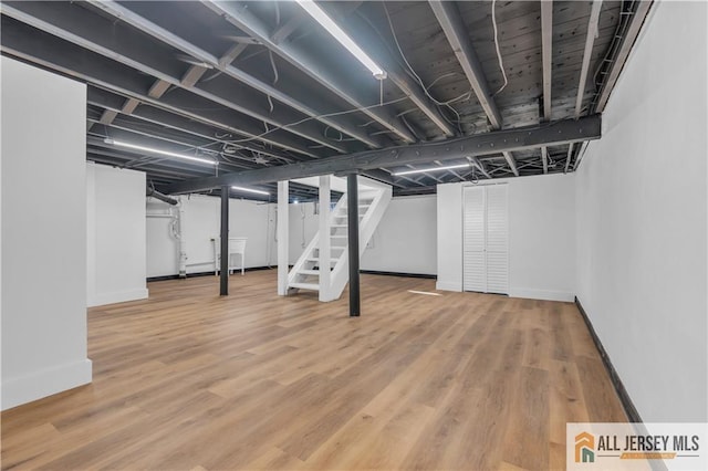 8 1st St, Sayreville, NJ 08872 - finished basement with stairs, baseboards, and wood finished floors