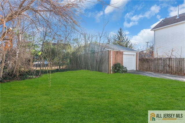 8 1st St, Sayreville, NJ 08872 - view of yard with driveway, an outbuilding, and a detached garage