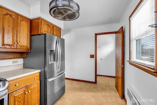 kitchen featuring ornamental molding and stainless steel fridge with ice dispenser