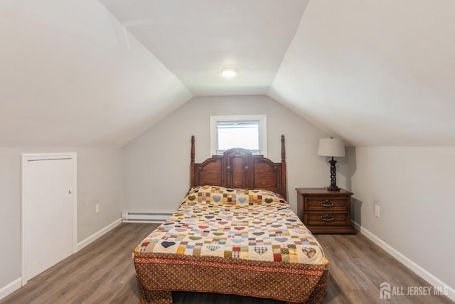 bedroom featuring baseboards, a baseboard radiator, lofted ceiling, and dark wood-type flooring