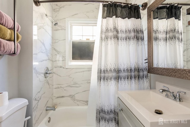 bathroom with shower / bath combo with shower curtain, toilet, and vanity