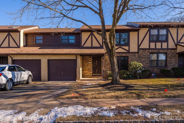 tudor-style house with a garage