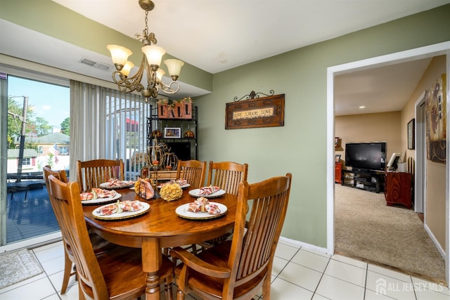 3 Romero Ct, Monroe, NJ 08831 - dining room featuring a chandelier, light tile patterned floors, baseboards, and light colored carpet