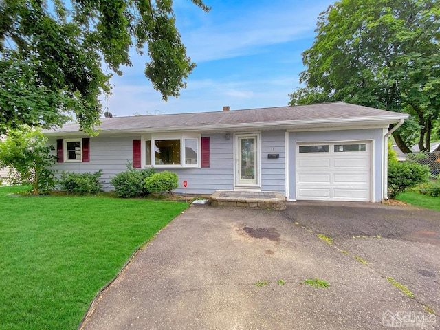 15 Race Track Rd, East Brunswick, NJ 08816 - ranch-style house with an attached garage, a front yard, and asphalt driveway