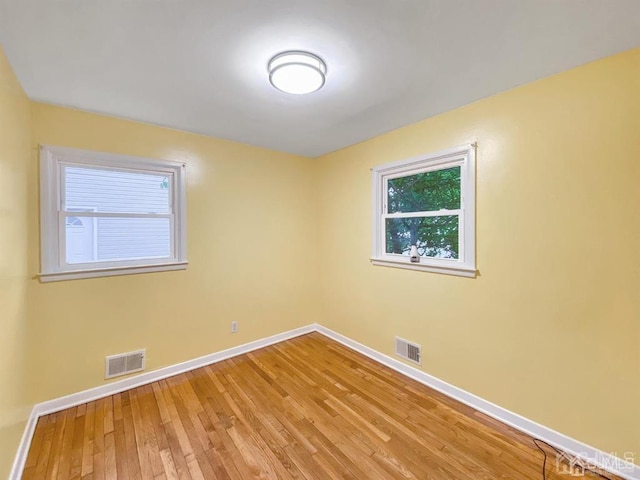 15 Race Track Rd, East Brunswick, NJ 08816 - spare room featuring light wood-type flooring and plenty of natural light