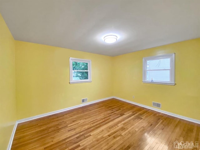 15 Race Track Rd, East Brunswick, NJ 08816 - empty room featuring hardwood / wood-style floors and plenty of natural light