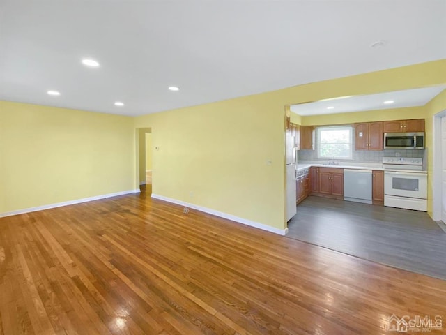 15 Race Track Rd, East Brunswick, NJ 08816 - unfurnished living room with wood finished floors and recessed lighting