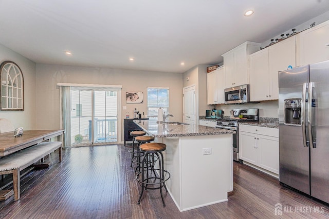606 Bayside Ct, South Amboy, NJ 08879 - kitchen featuring stainless steel appliances, dark wood finished floors, a sink, white cabinets, and recessed lighting