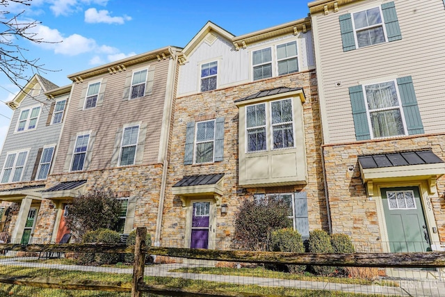 606 Bayside Ct, South Amboy, NJ 08879 - townhome / multi-family property with stone siding and a standing seam roof