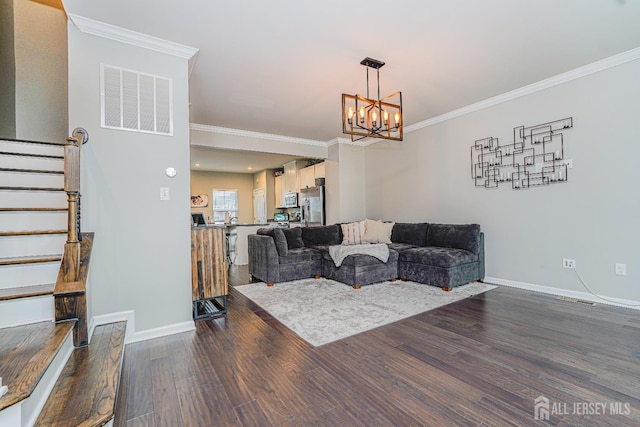 606 Bayside Ct, South Amboy, NJ 08879 - living area with stairs, a chandelier, ornamental molding, dark wood-style flooring, and baseboards