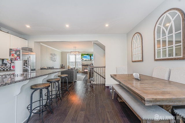 606 Bayside Ct, South Amboy, NJ 08879 - dining area with dark wood-style flooring, a chandelier, recessed lighting, and ornamental molding