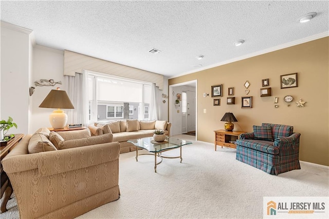 carpeted living area featuring visible vents, a textured ceiling, and crown molding