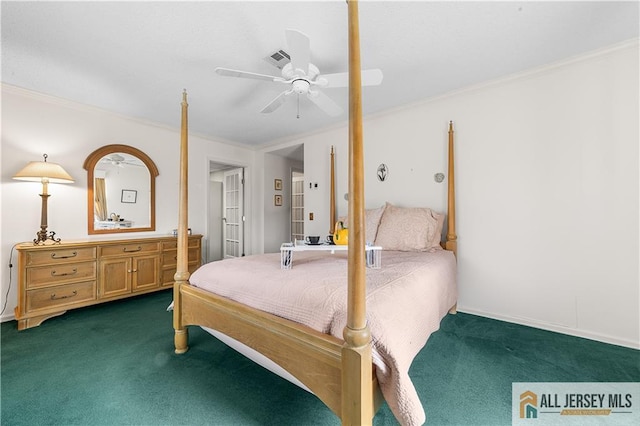 bedroom with dark colored carpet, visible vents, ceiling fan, and crown molding