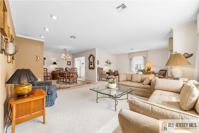 living area with visible vents, carpet floors, a chandelier, and ornamental molding