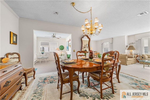 dining area with light carpet, plenty of natural light, and visible vents