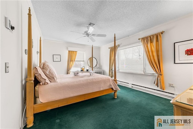 carpeted bedroom with a baseboard heating unit, a textured ceiling, visible vents, and a ceiling fan