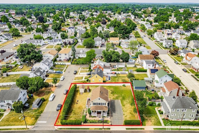 birds eye view of property with a residential view