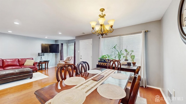 28 Clay St, North Brunswick, NJ 08902 - dining area with a chandelier, wood finished floors, recessed lighting, and baseboards