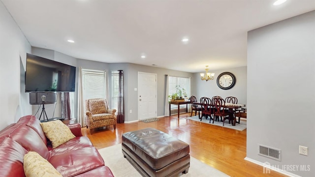 28 Clay St, North Brunswick, NJ 08902 - living area with a chandelier, light wood finished floors, recessed lighting, and baseboards
