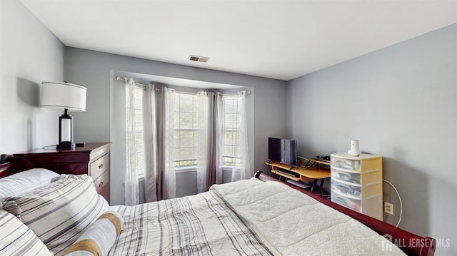 bedroom featuring visible vents