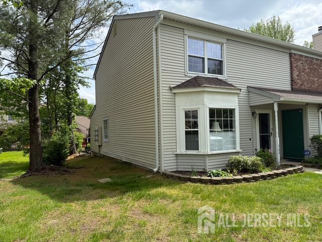 362 Minstrel Ct Unit 362, Old Bridge, NJ 08857 - view of front of home with a front yard and a chimney