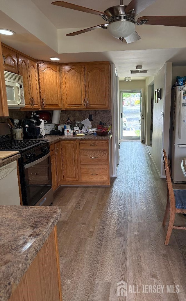 362 Minstrel Ct Unit 362, Old Bridge, NJ 08857 - kitchen with white appliances, a ceiling fan, brown cabinetry, and light wood-style flooring