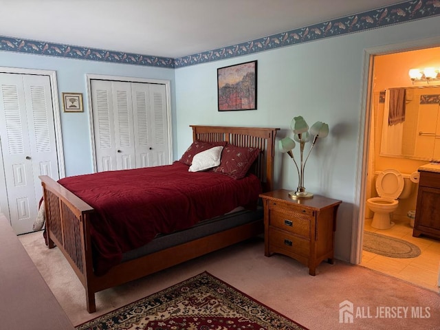 362 Minstrel Ct Unit 362, Old Bridge, NJ 08857 - bedroom with two closets, ensuite bath, and light colored carpet