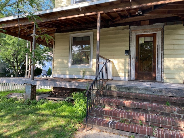 doorway to property with a porch