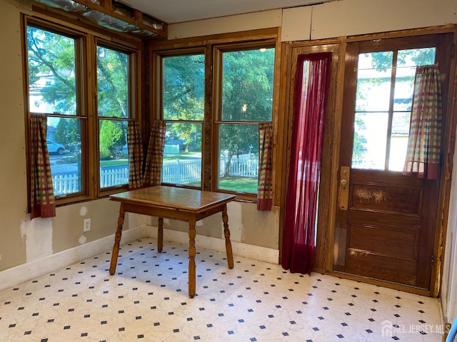 interior space featuring tile patterned floors and baseboards