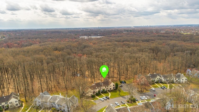 drone / aerial view featuring a view of trees