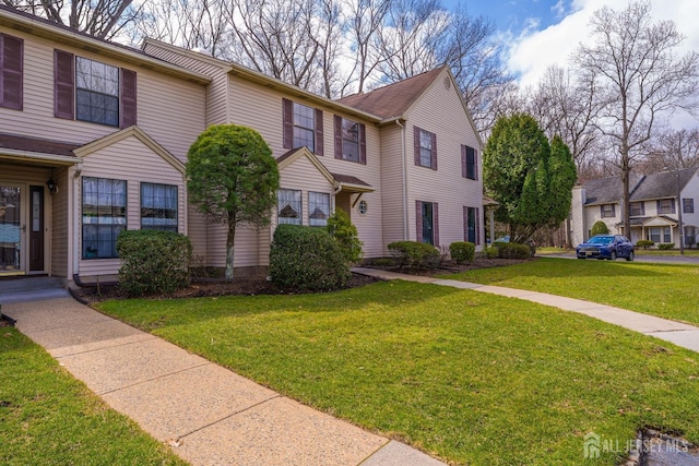 view of property with a front lawn