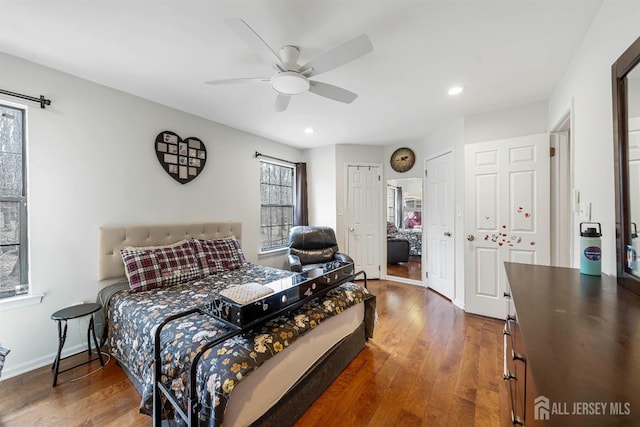 bedroom featuring wood-type flooring, a ceiling fan, baseboards, and recessed lighting