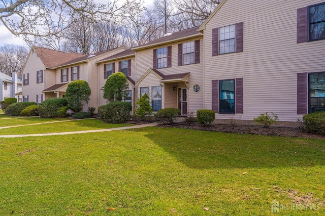 view of property featuring a front yard