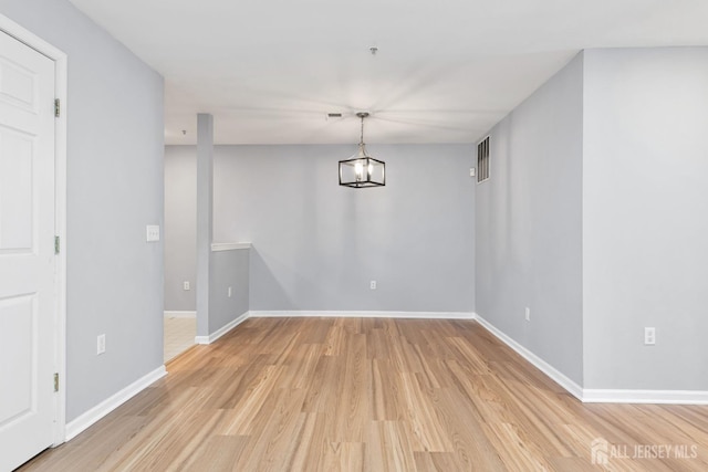 1 Lackland Ave, Piscataway, NJ 08854 - unfurnished dining area with light wood-type flooring and baseboards