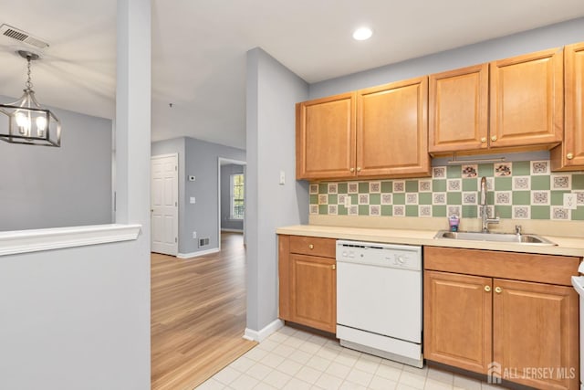 1 Lackland Ave, Piscataway, NJ 08854 - kitchen featuring white dishwasher, light countertops, light wood finished floors, recessed lighting, and decorative light fixtures