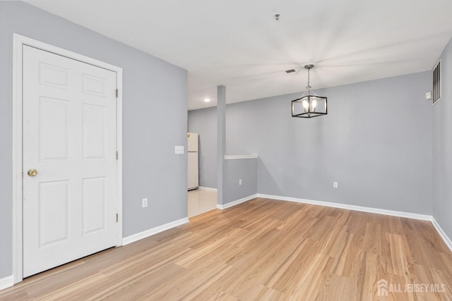 1 Lackland Ave, Piscataway, NJ 08854 - unfurnished dining area featuring light wood-style flooring and baseboards