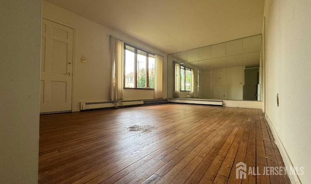 212 Middlesex Ave, Iselin, NJ 08830 - empty room featuring hardwood / wood-style flooring and baseboard heating