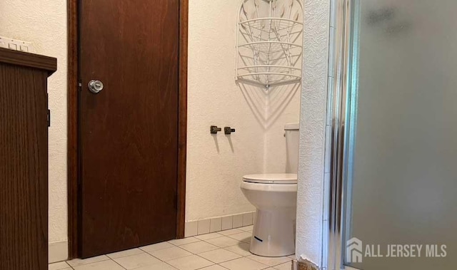 212 Middlesex Ave, Iselin, NJ 08830 - full bath featuring a stall shower, tile patterned floors, and a textured wall