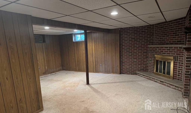 212 Middlesex Ave, Iselin, NJ 08830 - basement featuring carpet, a fireplace, a drop ceiling, and wooden walls