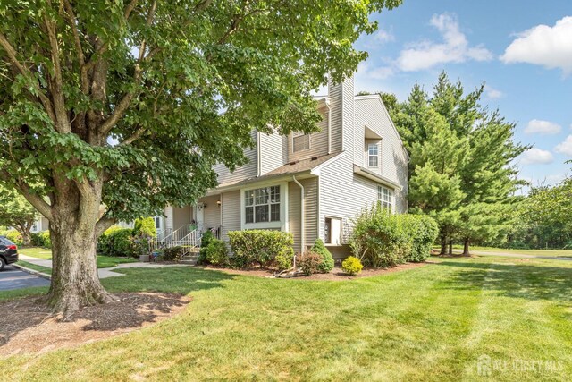 183 Driscoll Ct, Franklin Twsp, NJ 08873 - view of front of property featuring a front yard and a chimney
