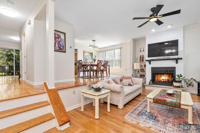 183 Driscoll Ct, Franklin Twsp, NJ 08873 - living room featuring light wood-style flooring, plenty of natural light, a brick fireplace, ceiling fan, and recessed lighting