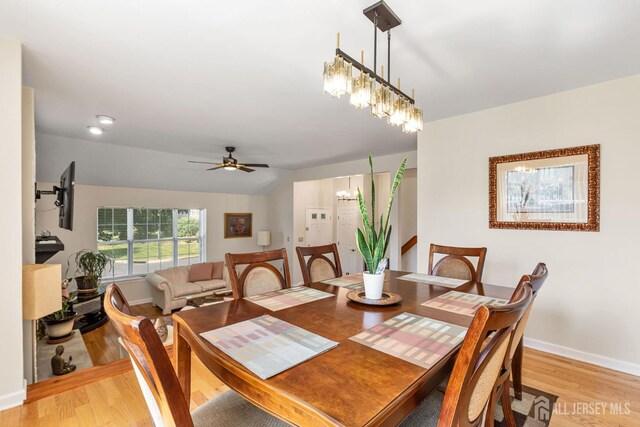 183 Driscoll Ct, Franklin Twsp, NJ 08873 - dining space featuring light wood-style floors, a ceiling fan, and a chandelier