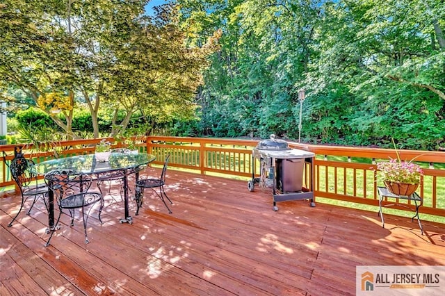 2 Danser Dr, Cranbury, NJ 08512 - wooden deck with outdoor dining space, area for grilling, and view of wooded area