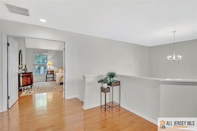 2 Danser Dr, Cranbury, NJ 08512 - hall with wood finished floors and a chandelier